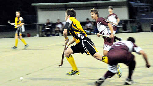 Cameron Baker for Granville heads through the Heat defence. Cameron Baker for Granville heads through the Heat defence.